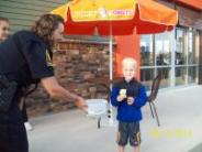 School Resource Officer collecting funds