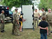 Showing a child how to batter down a door