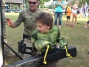 Showing a child how to batter down a door